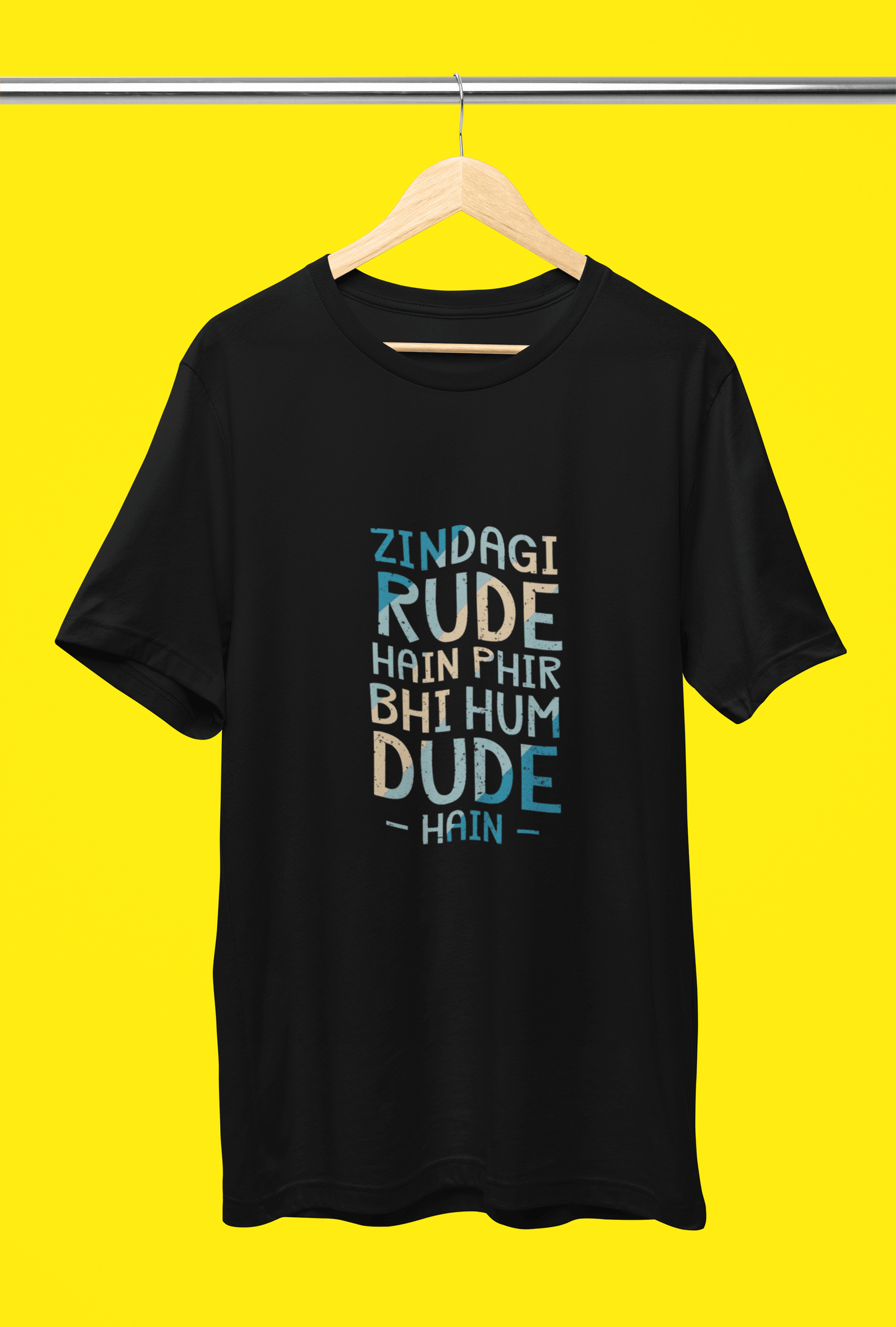Unisex black HUM DUDE HAIN t-shirt with vibrant text design on a yellow background.