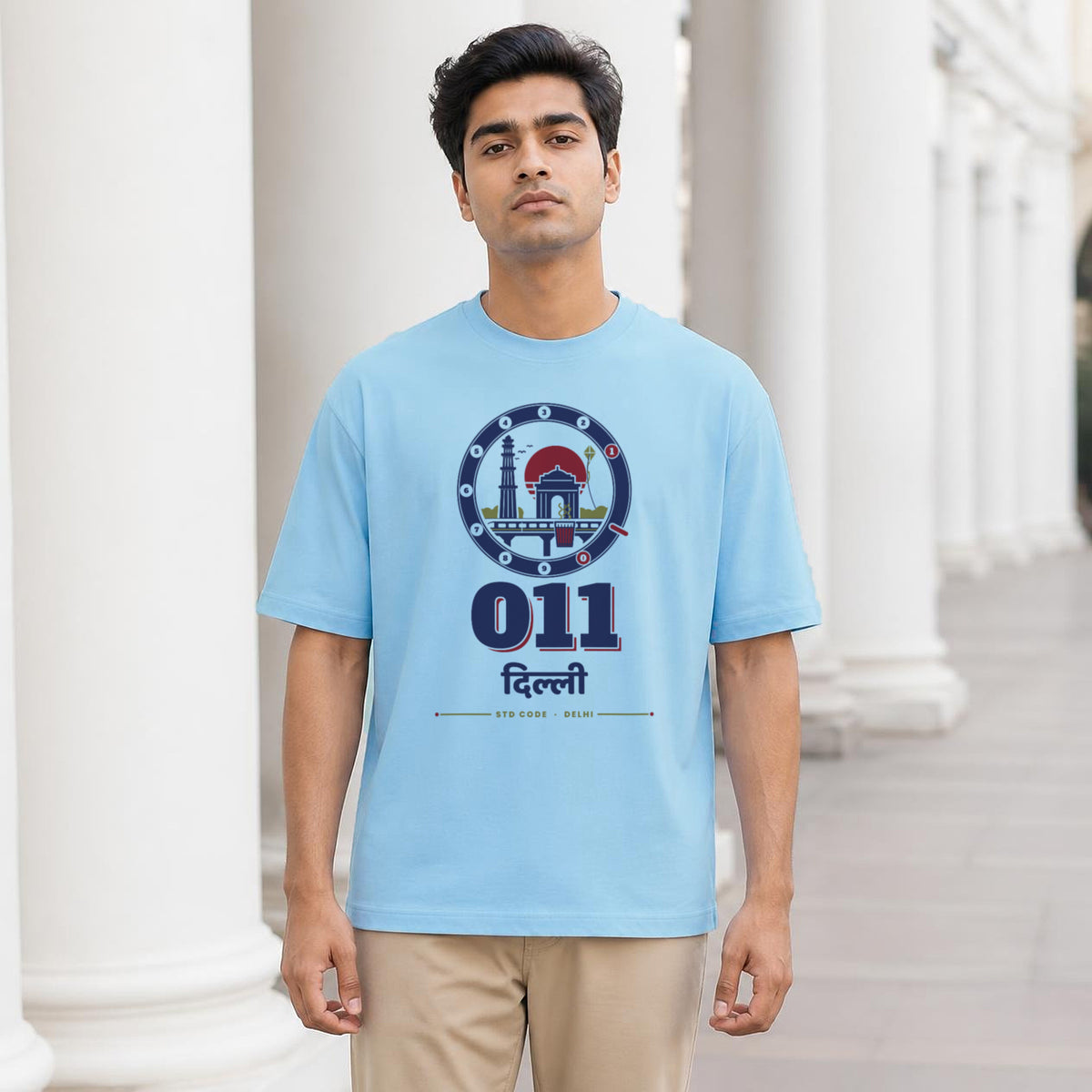 011 Dilli oversized cotton T-shirt in baby blue, man wearing it at Connaught Place, Delhi – Bonzo Peter's