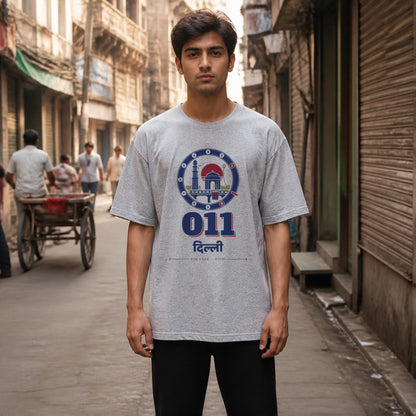 011 Delhi oversized cotton T-shirt in grey melange, man wearing it in an Old Delhi lane – Bonzo Peter's