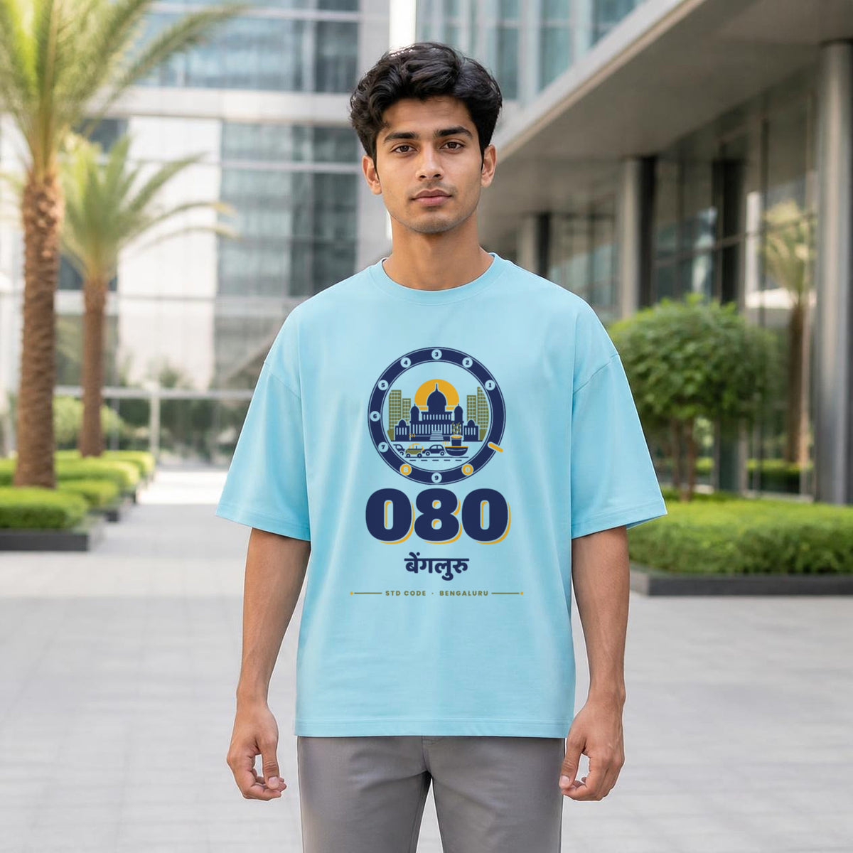 080 Bengaluru STD code oversized cotton T-shirt in baby blue, men's front view at a tech park, Bonzo Peter's