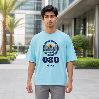 080 Bengaluru STD code oversized cotton T-shirt in baby blue, men's front view at a tech park, Bonzo Peter's