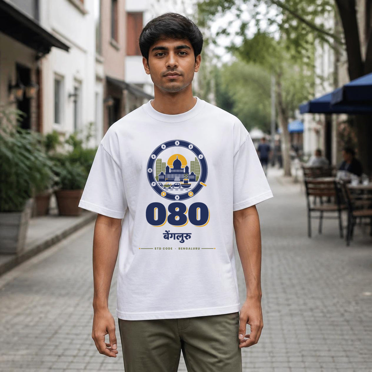 080 Bengaluru STD code oversized cotton T-shirt in white, men's front view on Church Street, Bonzo Peter's