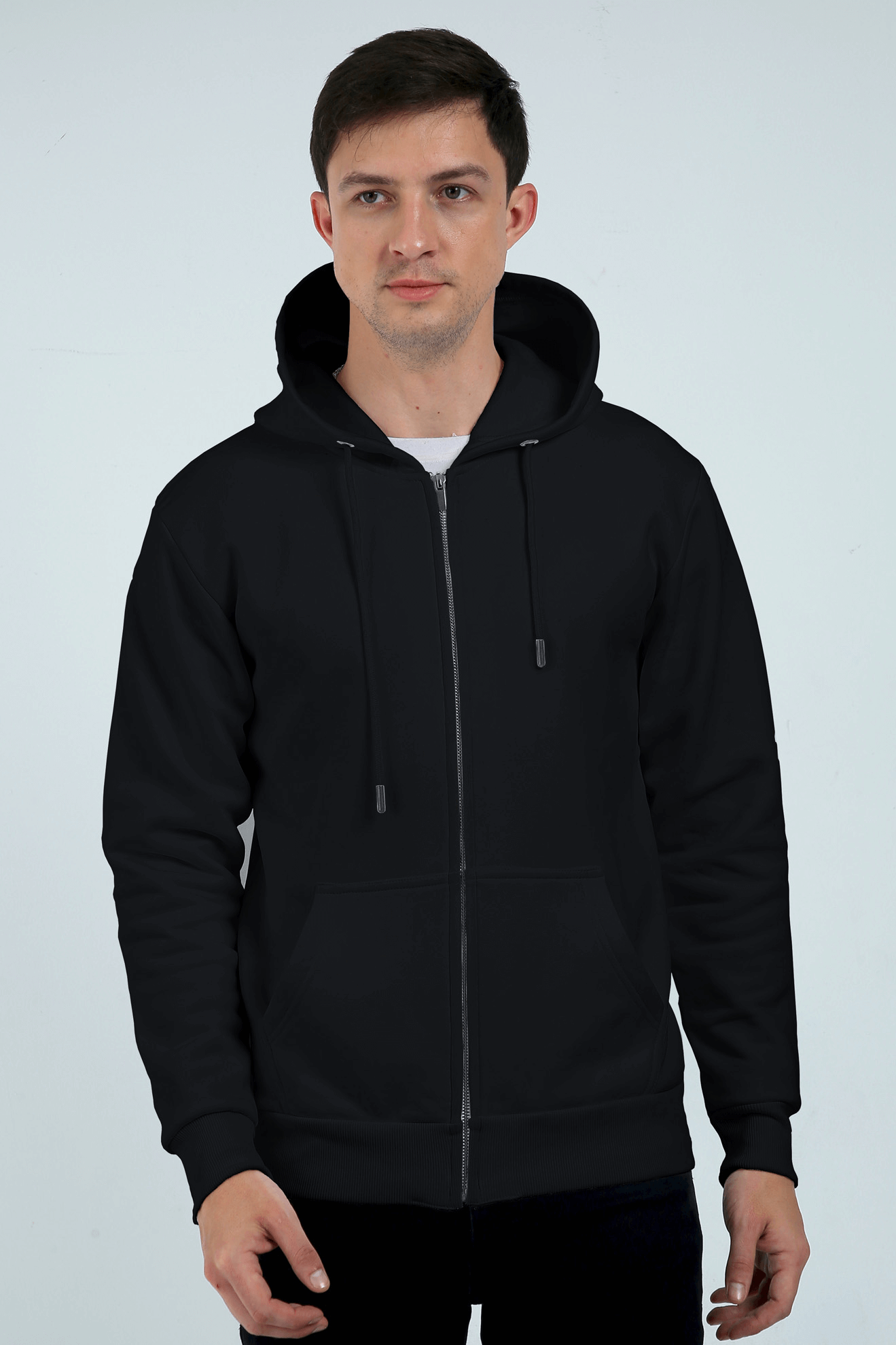 Man wearing a plain heavyweight black zipper hoodie, showcasing style and comfort with a durable 400 GSM fabric blend.