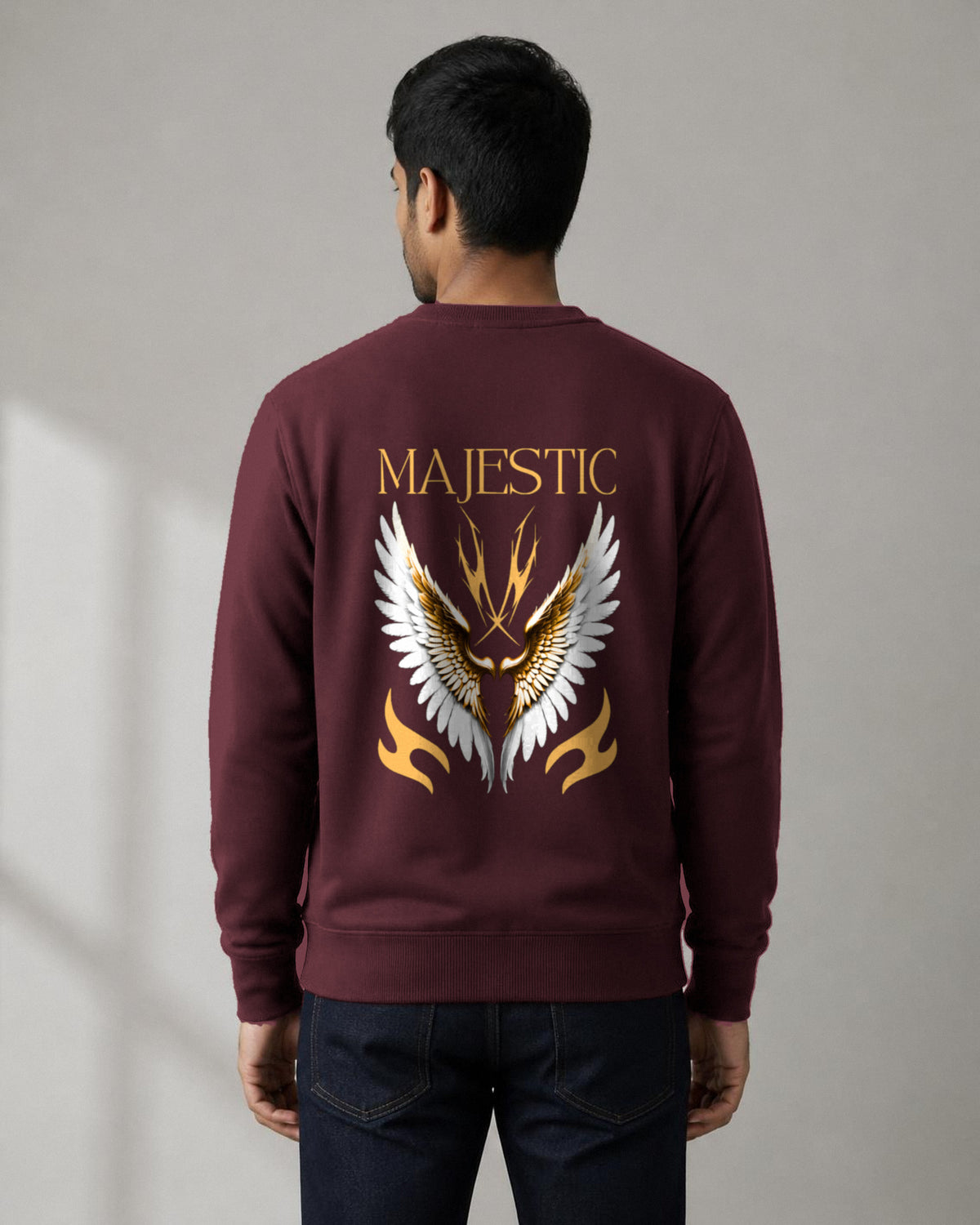Majestic Wings back print sweatshirt in Maroon worn by a model, Bonzo Peter's