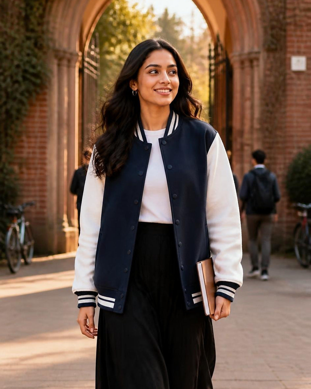 Bonzo Peter's navy blue varsity jacket with cream sleeves - woman at campus arch